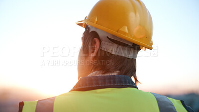 Buy stock photo Thinking, man and engineer outdoor for construction, inspection and idea for architecture. Back, male person and helmet with reflection, building view and quality assurance for urban infrastructure