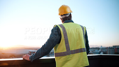 Buy stock photo Thinking, man and engineer on balcony for construction, inspection and idea for architecture. Back, male person and rooftop with reflection, building view and quality control for urban infrastructure