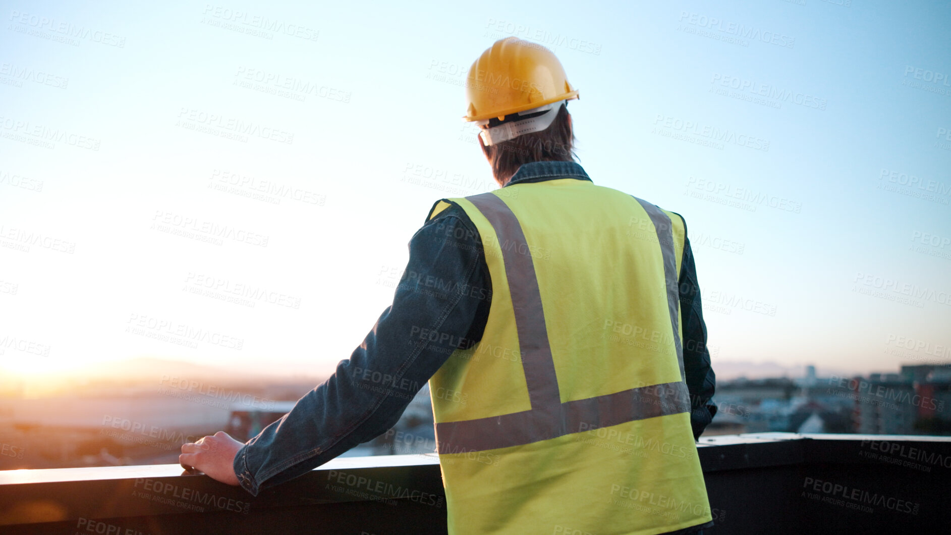 Buy stock photo Thinking, man and engineer on balcony for construction, inspection and idea for architecture. Back, male person and rooftop with reflection, building view and quality control for urban infrastructure