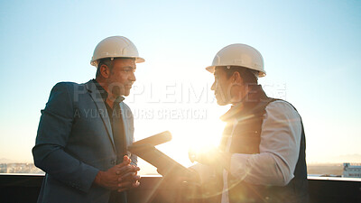 Buy stock photo Construction, tablet and men on rooftop for discussion, real estate development and flare in city. Tech, architect and team planning outdoor, property project and building review with sunshine