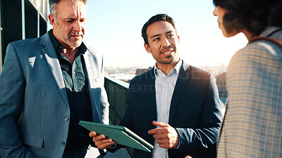 Buy stock photo Tablet, team and business people on roof for conversation, real estate evaluation or urban development. Tech, meeting and realtor with plan for property value, idea and listing suggestion in city