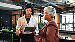 Discussion, tablet and woman with manager in office for planning, meeting and update on finance report. Corporate, lobby and business women on tech for financial review, feedback or advice for budget