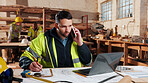 Carpenter, writing and phone call in warehouse with laptop, timber order and stock checklist. Man, planning and contact at PC with clipboard, project management and lumber production price update