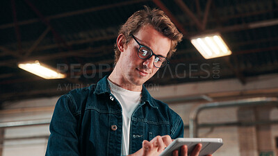 Buy stock photo Man, glasses and reading in tablet in factory, check order or online inventory management. Person, supervisor and tech for digital stock analysis or search merchandise app or website for information