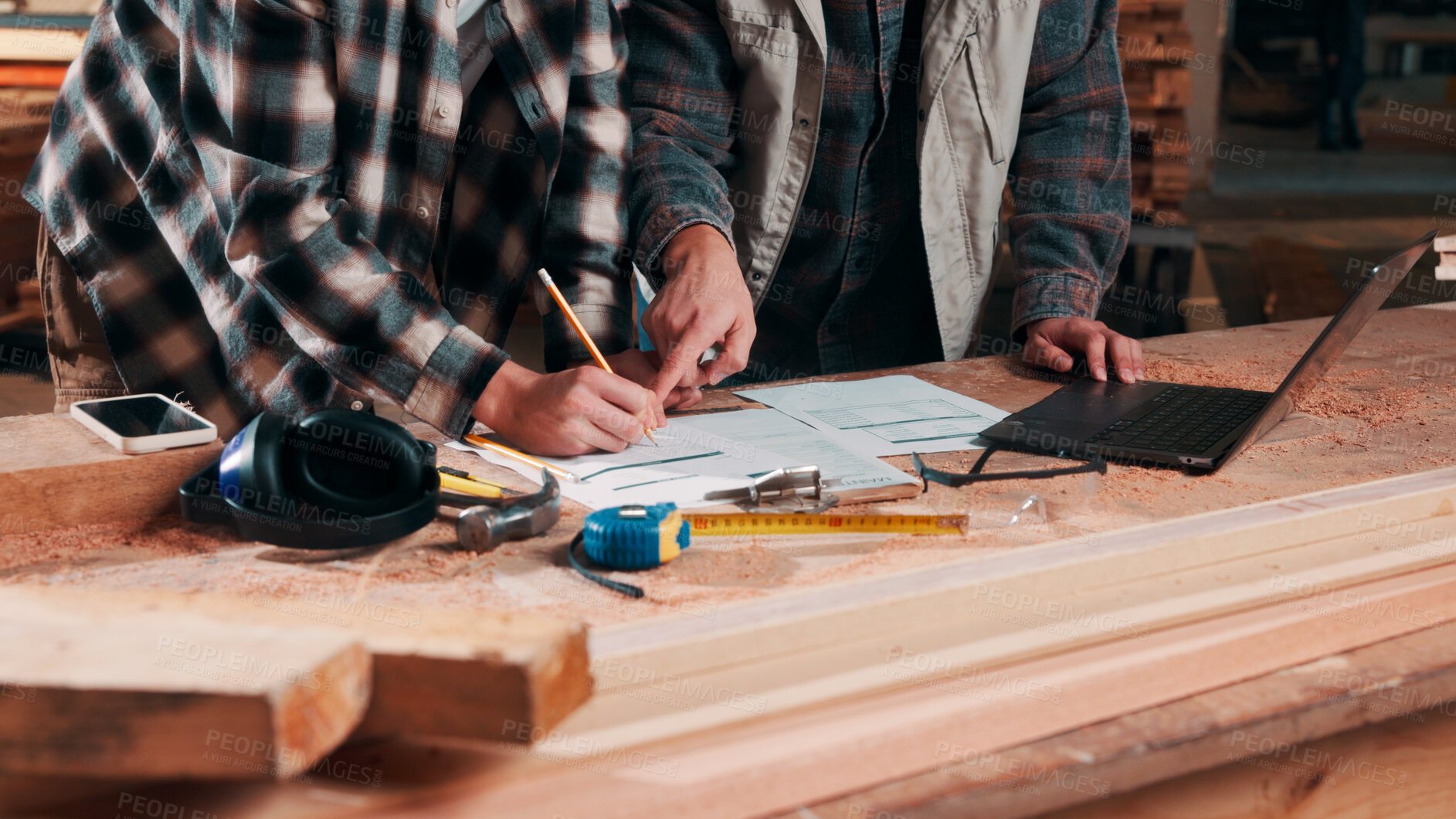 Buy stock photo Hands, writing and documents in lumber workshop, carpenter and team with invoice, laptop and woodwork. Workspace, collaboration and people with tech, notes and online order with carpentry planning