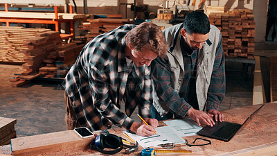 Buy stock photo Men, laptop and documents in lumber workshop, carpenter and team with invoice, writing and woodwork. Conversation, collaboration and people with tech, notes and online order with carpentry planning