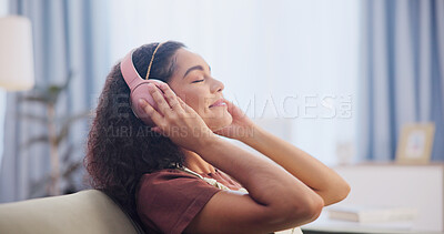 Buy stock photo Headphones, relax and woman on sofa for music subscription, streaming and track on weekend. Happy, home and person with audio, radio and podcast for chill, good mood or break for peace, calm and rest
