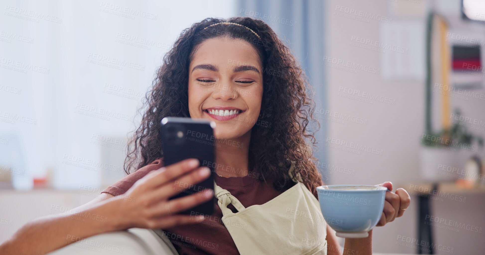 Buy stock photo Phone, coffee and woman on sofa in home with texting, social media or networking on mobile app. Happy, relax and person with warm beverage on cellphone for reading blog in living room at house.