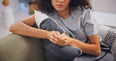 Buy stock photo Woman, stress and fidget nails on sofa in home with schizophrenia, mental health and doubt. Psychology, person with depression and worried with anxiety, trauma and fear on couch in living room