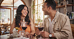 Happy, conversation and couple with wine in restaurant for date, celebration and romantic dinner together. Fine dining, love and man with woman with alcohol for talking, anniversary and relationship