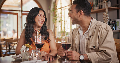 Buy stock photo Happy, conversation and couple with wine in restaurant for date, celebration and romantic dinner together. Fine dining, love and man with woman with alcohol for talking, anniversary and relationship