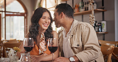 Buy stock photo Happy, talking and couple with wine in restaurant for date, whisper and romantic dinner together. Fine dining, love and man with woman with alcohol for conversation, anniversary and relationship