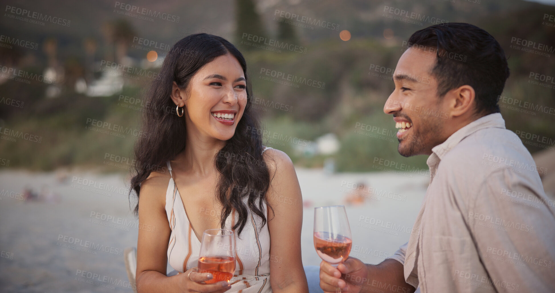 Buy stock photo Love, happy or couple at beach with wine, holiday together or bonding with anniversary celebration. Smile, honeymoon or people with alcohol, partner connection or special moment on outdoor getaway.