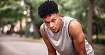 Fatigue, portrait and man at park, fitness and breathing after physical activity and tired on break. Exhausted, runner and workout recovery in nature, space and person with sweat or health on weekend