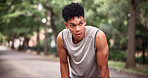 Man, thinking and fatigue at park, fitness and breathing after physical activity and tired on break. Exhausted, runner and workout recovery in nature, space and person with sweat or health on weekend