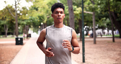 Buy stock photo Running, fitness and man at park for exercise, serious and physical activity for health or practice. Outdoor, athlete and person on road for workout, endurance and active for wellness in nature