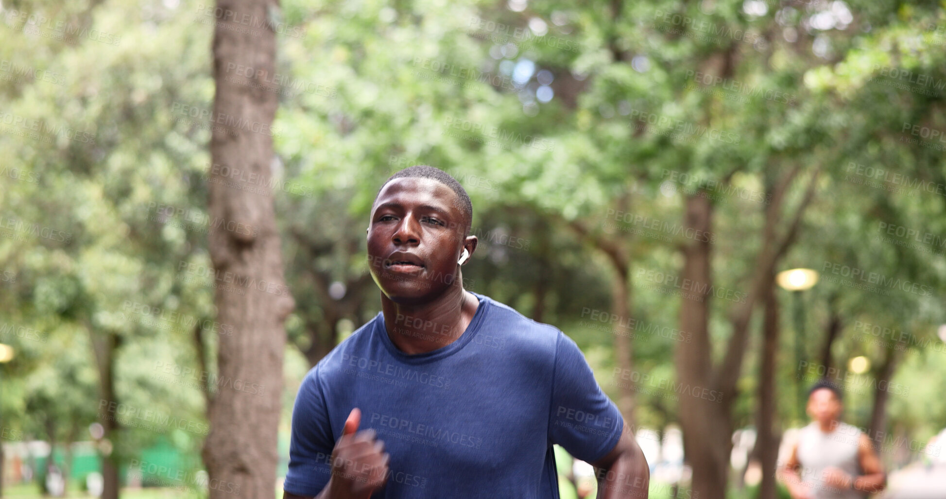 Buy stock photo Running, fitness and man with earphones for workout, sweat and physical activity with song playlist. Outdoor, athlete and person with technology for exercise, endurance and listening to music at park