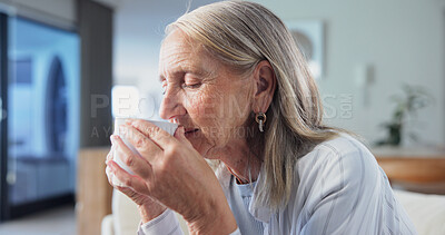 Buy stock photo Senior, woman and smell coffee in home with wellness, thinking and relax for peaceful retirement. Calm, pensioner and female person rest in living room with drink aroma, morning reflection or vision.