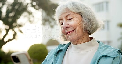 Buy stock photo Phone, smile and senior woman outdoor with texting, social media or chatting on mobile app. Happy, technology and elderly person in retirement with cellphone for reading blog on website in backyard.