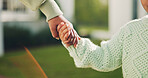 Parent, holding hands and bonding with child, outdoor and support for daughter on break or childcare. Family, love and person with kid on weekend, development and connection with mother at house