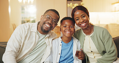 Buy stock photo Happy, portrait and child with parents on sofa in home for bonding, love and connection on weekend. Smile, relax and African boy kid with mother and father in living room for care together in house.