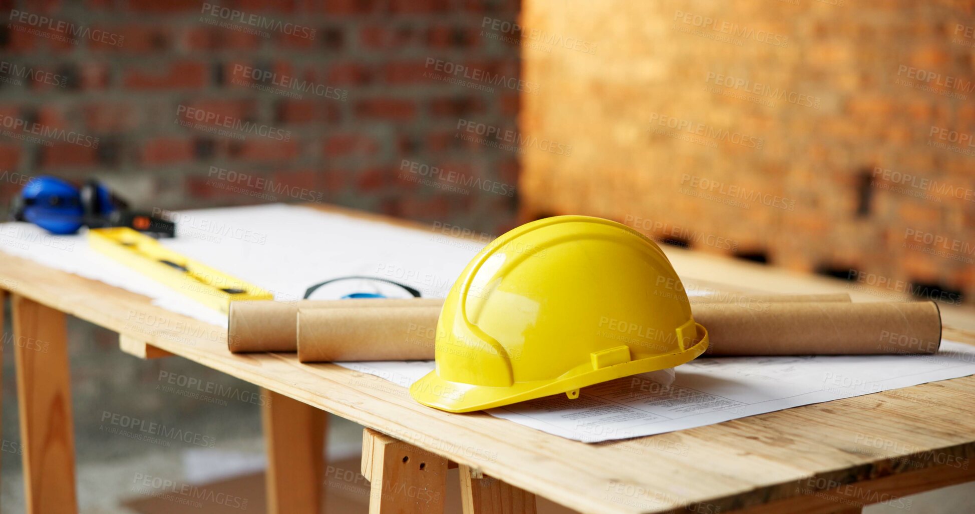 Buy stock photo Blueprint, architecture and helmet on construction site for safety, PPE or building security. Project, documents or paperwork with floor layout or tools for civil engineering design or infrastructure