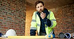 Construction, man or talk with radio in building for site inspection, hazard reporting or workflow. Project manager, worker and communication for quality control, safety compliance and labor pacing