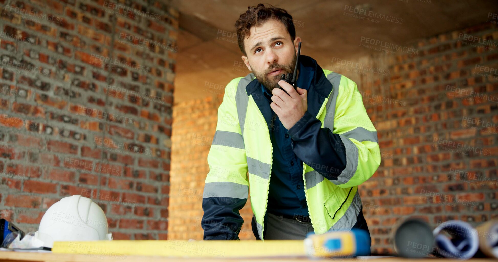 Buy stock photo Construction, man or talk with radio in building for site inspection, hazard reporting or workflow. Project manager, worker and communication for quality control, safety compliance and labor pacing