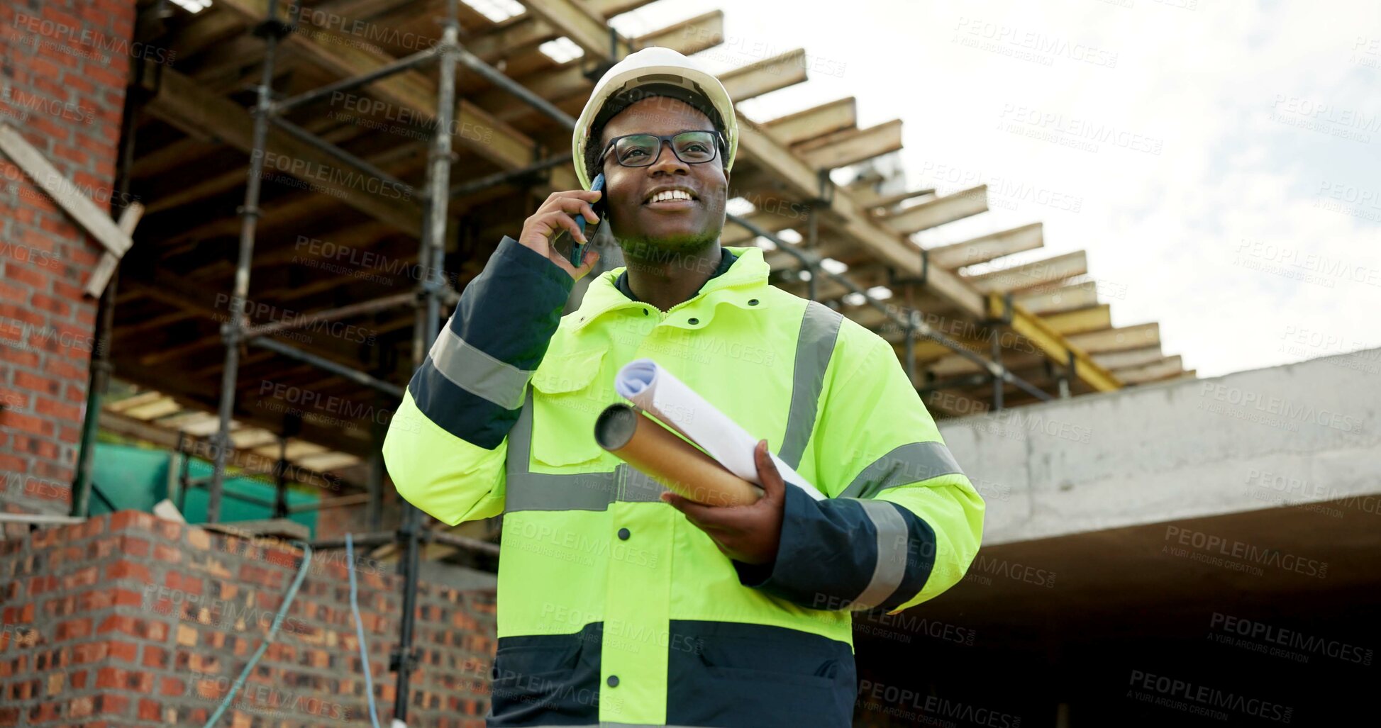 Buy stock photo Architect, smile and man with phone call for construction, confirm progress or project update. Architecture, black person and blueprint with mobile talk for building reporting, feedback and site chat