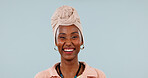 Portrait, black woman and laugh in studio with fashion, traditional and stylish turban for culture. Mockup space, person and humor with headwear, handmade necklace and heritage on blue background
