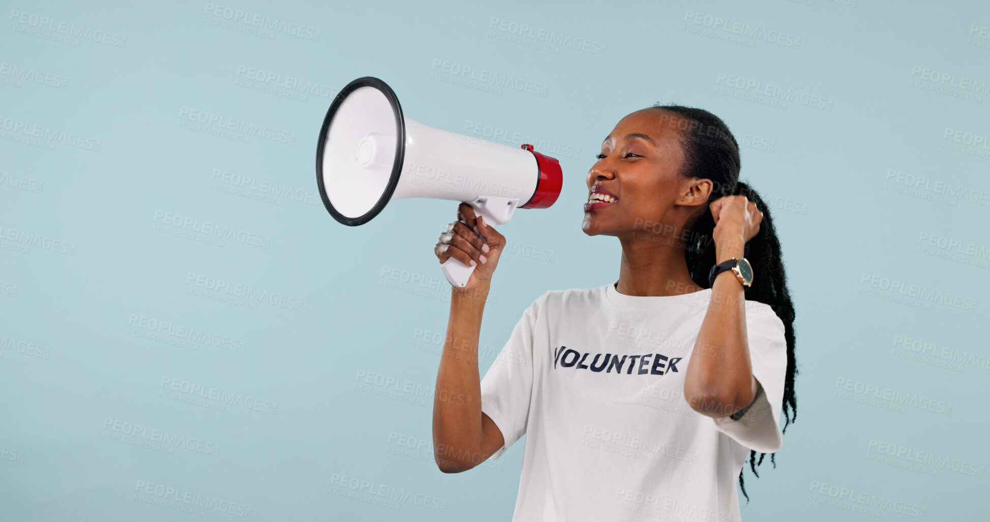 Buy stock photo Volunteer, megaphone and black woman in studio for awareness campaign on a blue background. Happy person, space or activist talking with bullhorn speaker for alert, announcement or charity donation