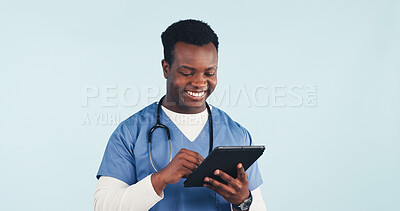 Buy stock photo Nurse, tablet and black man in studio for medical research or schedule on a blue background. Happy, male person or healthcare worker with smile or technology for Telehealth app or health report