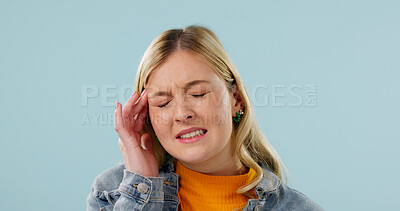 Buy stock photo Headache, tired and woman in studio with pain, frustrated or tension with discomfort. Fatigue, space and female person on blue background with migraine pressure, burnout or sore head with dizziness. 