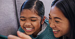 Mom, child and smile with phone on sofa for entertainment, bonding or online subscription in home. Mother, daughter or kid with digital tech for movie, show app or game choice together in house