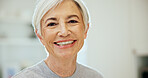 Happy, calm and portrait of senior woman in home with positive attitude, relax or chilling on weekend. Smile, pension and elderly person in retirement with morning break in living room at apartment.