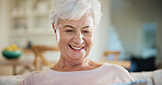 Happy, thinking and senior woman in home with relax, positive attitude and planning pension. Smile, weekend and elderly person on sofa in living room for retirement memory, nostalgia or remember.