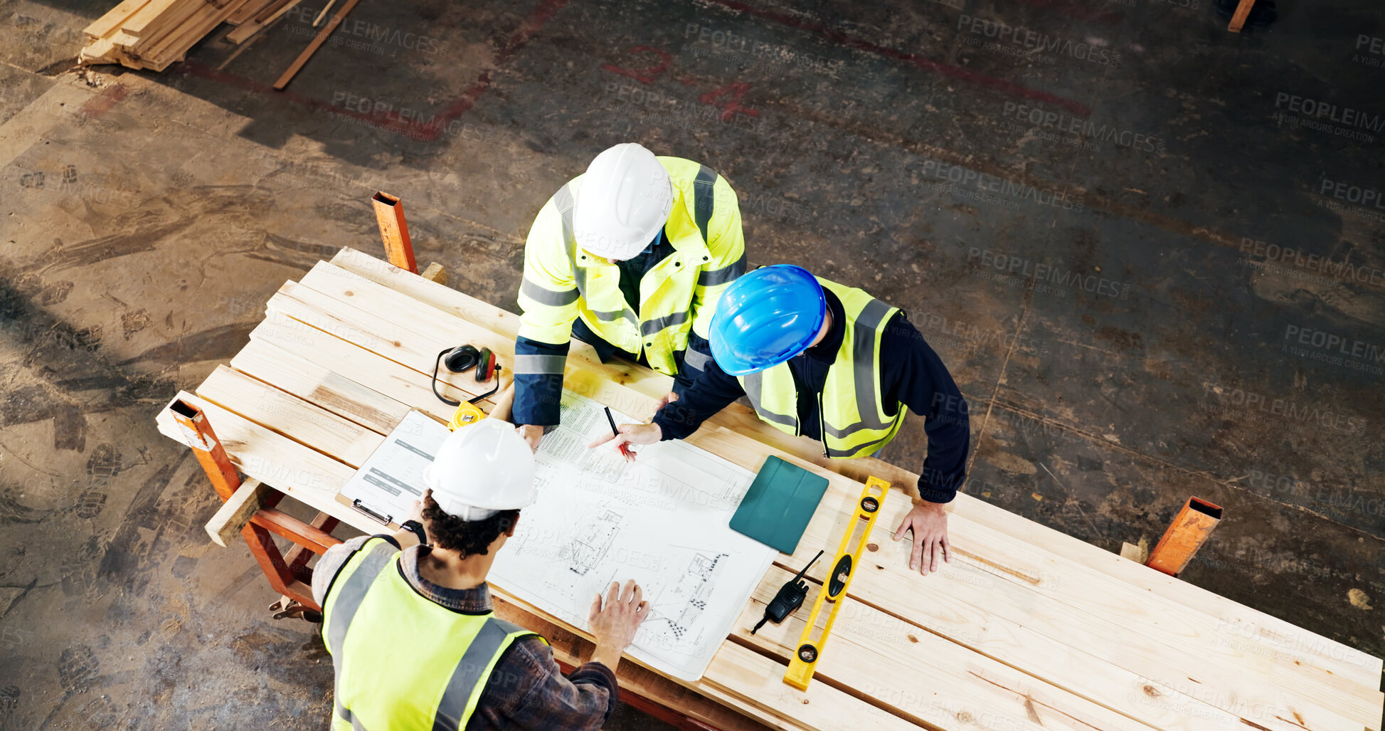 Buy stock photo Above, engineer and planning with blueprint at construction site, building development or strategy. Architect team, people and discussion with document for infrastructure design, review and top view