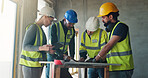 Talking, construction and people in building with tablet for planning, teamwork and project update. Architecture, contractor and workers in meeting for development, renovation and engineering design