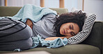 Sick, fatigue and woman with stomach pain in blanket for norovirus oubreak, fever or tummy cramps. Unwell, girl or belly inflammation in home from food poisoning, illness recovery and gut discomfort