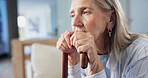 Old woman, sad and thinking with cane in retirement facility, mental health and serious nostalgia. Person with depression, pension and walking stick with past perspective, memory or remember history