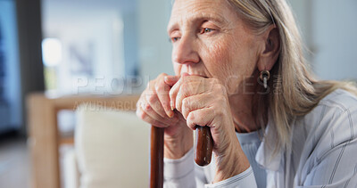 Buy stock photo Old woman, sad and thinking with cane in retirement facility, mental health and serious nostalgia. Person with depression, pension and walking stick with past perspective, memory or remember history