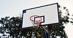 Outdoor, fitness and basketball hoop on empty court for game, training or workout with competition. Trees, nature and sports equipment with net for match, practice or exercise with challenge.
