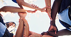 Nature, group and people holding arms for support, solidarity and trust in non profit organization. Bonding, low angle and circle of volunteers with hands together for connection in ngo at park