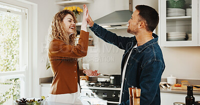 Buy stock photo Love, high five and cooking with couple in kitchen for romance, support or connection. Happy, diet win and lunch success with man and woman in home for marriage commitment, celebration and motivation