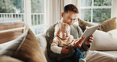 Buy stock photo Dad, boy and relax with tablet on couch for elearning video, bonding and smile in living room. Man, father and child with tech, movies and streaming subscription with funny cartoon in family house
