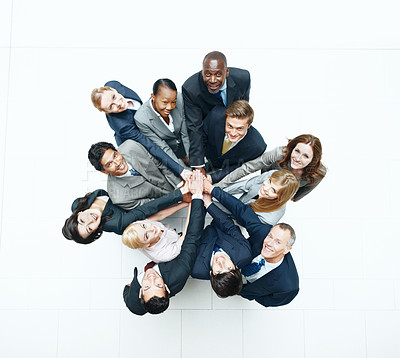 Buy stock photo Portrait, huddle and business people in office with hands together, diversity and unity for cooperation. Above, happy employees and solidarity in firm with synergy, support and team collaboration.