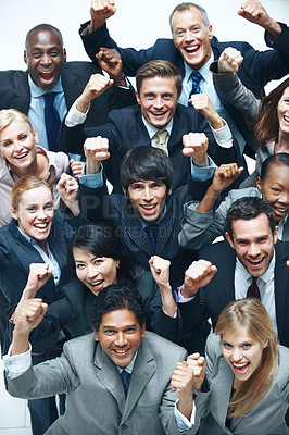 Buy stock photo Portrait, celebration and excited business people in office with smile, profit achievement and success. Above, happy team and cheering in workplace with corporate deal, revenue goals and solidarity.