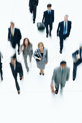 Buy stock photo Smile, motion blur and portrait of business woman at airport for networking event, travel or commute. Journey, b2b conference and layover with above of employees in terminus lobby for convention