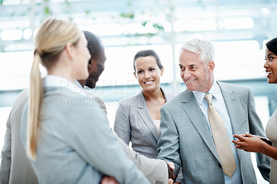 Buy stock photo Team, success and handshake with client in office, laughing or agreement for investment opportunity. Corporate, investor and shaking hands with happy people, collaboration and funding negotiation