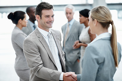 Buy stock photo Lobby, welcome and business people with handshake in office for agreement, meeting and partnership. Finance, conference and man with woman shaking hands for teamwork, collaboration and thank you